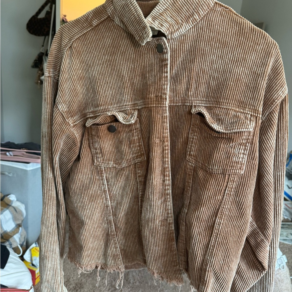 POL brand size large. Used and good condition. Warm brown color & distressed